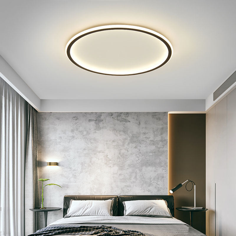 Rund LED-taklampa med minimalistisk ringdesign i takmiljö