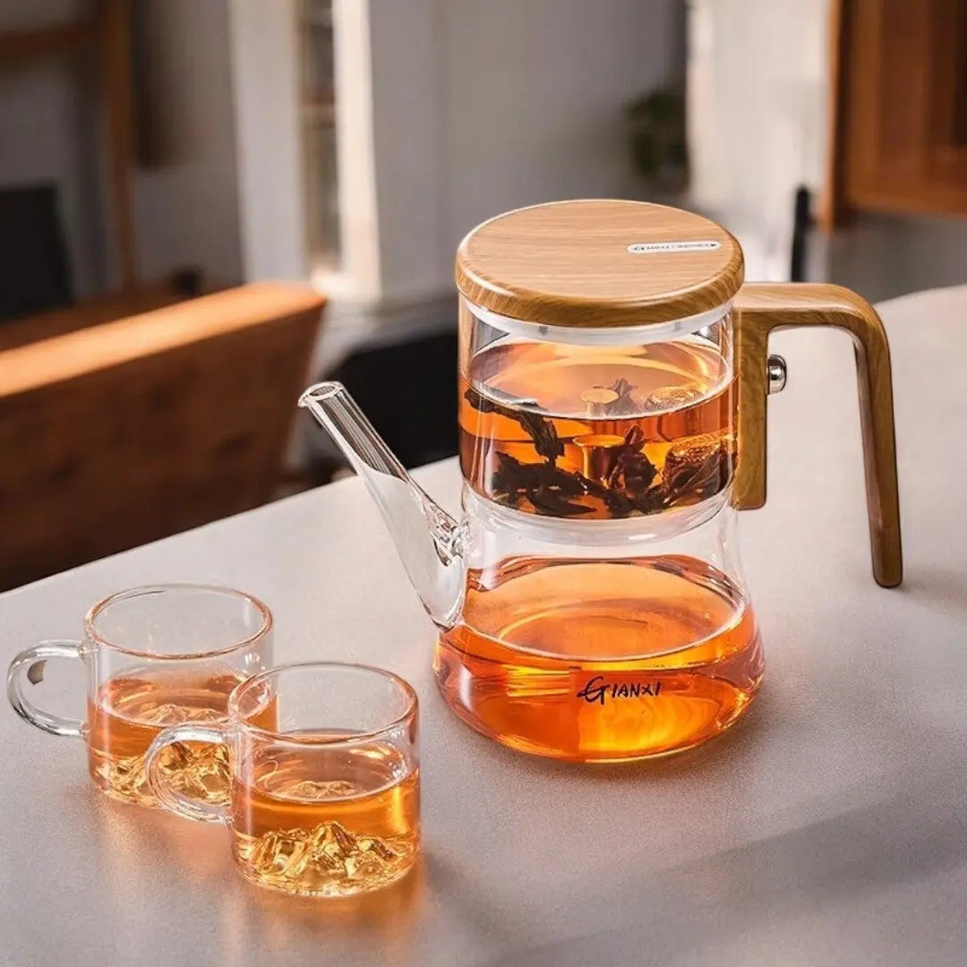 Genomskinlig glasstekanna med magnetisk bryggare och handtag med träeffekt
