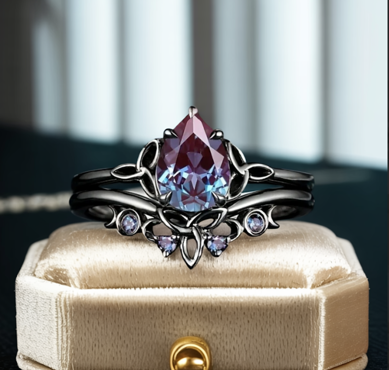 Dekorativ silverfärgad vintageinspirerad ring med droppformad lila och blå sten