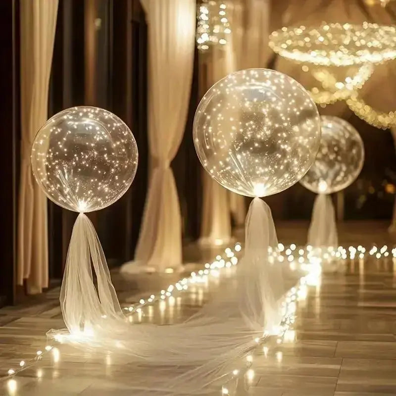 Transparenta ballonger med varm ljusdekoration i set om 10