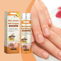 Nagelspray i silverfärgad och orange sprayflaska med orange kartongförpackning
