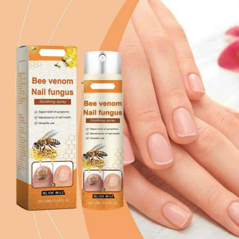 Nagelspray i silverfärgad och orange sprayflaska med orange kartongförpackning