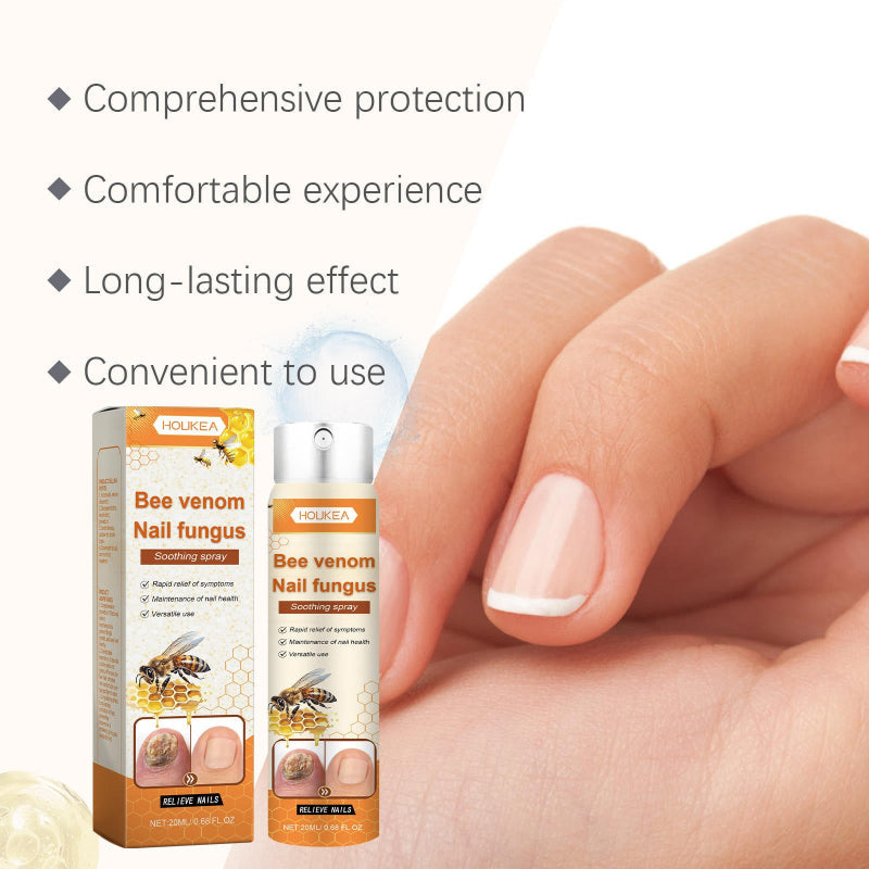 Nagelspray i silverfärgad och orange sprayflaska med orange kartongförpackning