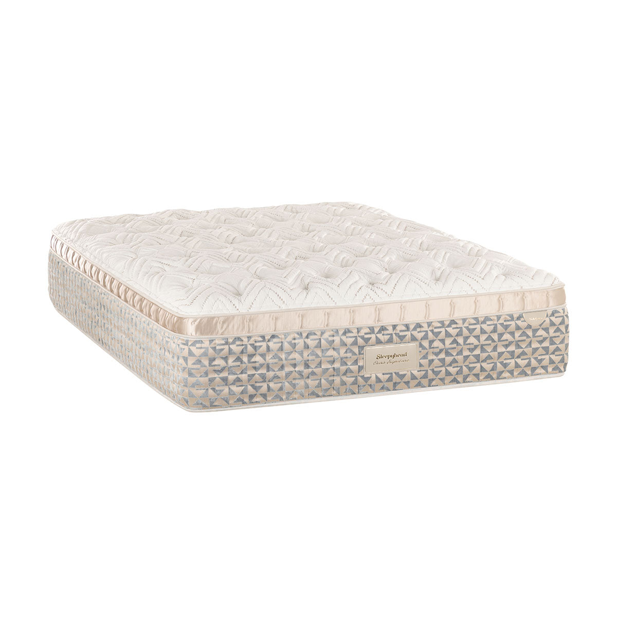 Beige madrass med quiltad ovansida och geometriskt mönstrad sidokant
