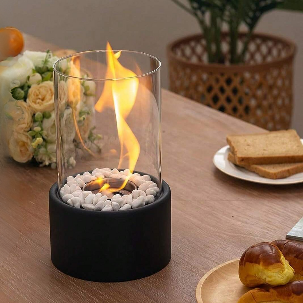 Fristående oljelampa med glasbehållare, rund bas och dekorstenar