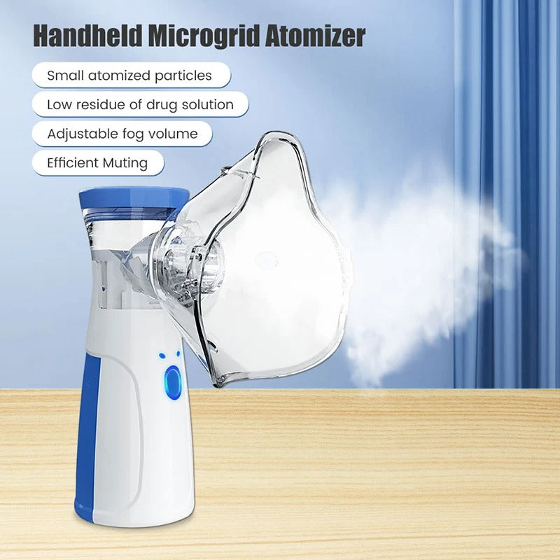 Vit och blå handhållen nebulisator med genomskinlig ansiktsmask