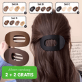 Platt oval hårklämma med genombruten mitt i flera färgvarianter