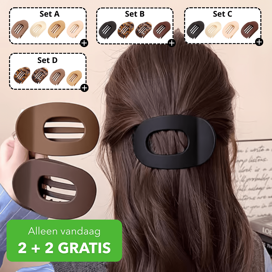 Platt oval hårklämma med genombruten mitt i flera färgvarianter