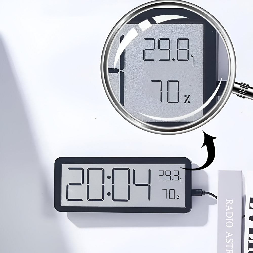 Digital väggklocka med visning av tid, temperatur och luftfuktighet
