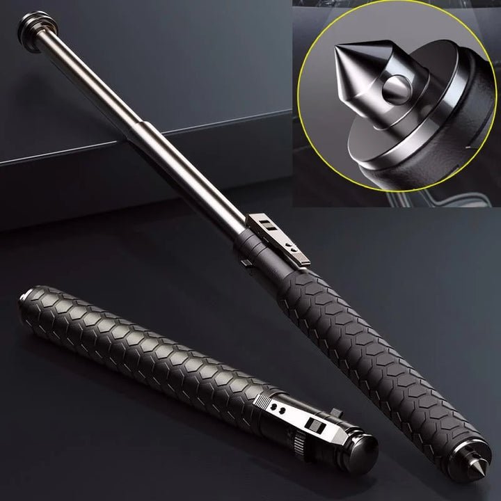 Hopfällbar försvarsstav med svart texturerat grepp och silverfärgad metallstav