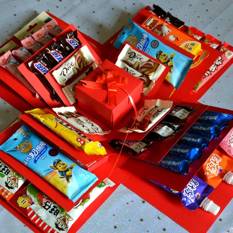 Explosionsbox med lock, presentband och fjärilsdekorationer