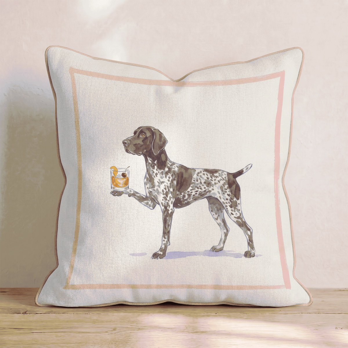 Beige dekorativ kudde med illustrerat hundmotiv och färgad ram