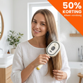 Handhållen hårstylingborste med borsttänder, handtag och kontrollknappar